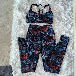 Lululemon size 4 sports bra and leggings in a black/blue/red floral print